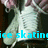 A pixelated image of a person in white clothing with pink hair, showing text that reads 'ice skating is life.'
