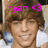 Pixelated image of a person with brown hair wearing a white shirt, overlaid with bright pink text reading 'ryan <3' at the top.