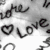 Animated icon displays multiple 'LOVE' text variations with heart symbols, transitioning between grayscale and colored styles.