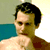 A 2x2 contact sheet of a pixelated animated icon featuring a shirtless man with dark hair in two frames and a