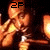 Animated sequence of a figure in orange tones holding a hammer, with text '2PAC' appearing in top-left and bottom-right corners across frames.