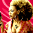 Pixelated static image of a character with blonde hair and dark sunglasses against a pink background, wearing a light-colored outfit with visible chest details.