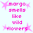 Pixelated pink text reads "margo smells like wild flowers" surrounded by four pink starbursts on a light blue background.