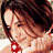 A 48x48 pixel animated contact sheet showing three sequential frames of a woman with brown hair in different poses and expressions, displayed on a gray background.