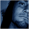 repeated blue-toned images showing a person's face with long dark hair and stubble, overlaid with partially visible text reading "CALL" and "KHRI"