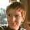 Two pixelated headshots of a person with short brown hair appear above a plus sign, which transitions to an equal sign, followed by text reading DOUBLE THE TROUBLE.