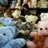Pixelated image divided into four quadrants with blue and gray backgrounds, featuring pink text and a blurred figure.