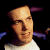 Pixelated image of a person with light skin and short hair wearing a white shirt, next to green text reading 'Original Icons .com' on dark background.