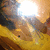 A yellow and brown object with a bright light source shifts position across four , showing subtle movement in the light's angle and the object's orientation