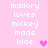 Pixelated text on pink background with two heart symbols, one on each side of the text block.