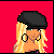 Pixel art of a blonde woman with black beret and hoop earrings, wearing black top and blue jeans against red background; text below reads 'Alicia Is Sexi<3' in red.
