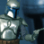 Static pixelated image of a humanoid figure in armor with helmet, holding an object against dark blue background.