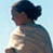 Pixelated static image of a person with dark hair and light skin wearing a gray top against a light blue background, likely from an old AOL Instant Messenger buddy icon.