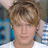 A pixelated image shows a person with light brown hair and blue eyes on the left, next to bright pink background with blue text reading "People marching to the drums...".