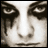 Pixelated grayscale face with dark eye sockets, a bright vertical nose bridge, and two small nostrils; the right side shows a tear-like streak.
