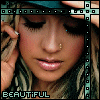 A pixelated close-up of a person with blonde hair wearing a blue cap, holding hands near their head, and the word 'BEAUTIFUL' in block letters at the bottom.