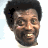 Pixelated image of a smiling person with short dark hair against white background, next to blue text reading "No Worries" on black and gray backgrounds.