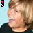 Animated sequence of a person with light brown hair in profile view, wearing black clothing against light blue background.