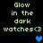 Pixelated text reads "Glow in the dark watches<3" with a blue heart symbol on a black background, displayed in two identical