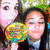 A split-screen image shows two distinct groups of people: one in color with a rainbow lollipop and another in grayscale.