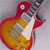 Animated sequence of a red and yellow electric guitar with visible text changes across frames.