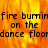 Animated fire background with repeated text 'fire burning on the dance floor' in black pixelated font, showing a split-screen effect with a gray rectangle on the right.