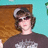 Pixelated image of a person in a brown shirt and cap against a teal wall, with pink text reading "Zac you're absoulutly amazing!" and "I love you."