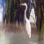 Animated icon shows a figure with long dark hair and white clothing against blurred background, transitioning to green screen text.