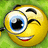 Pixelated yellow emoji face with one large blue eye, winking eye, and wide smile showing teeth and red lips against green background.