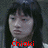 Two side-by-side pixelated images of a person with long dark hair and bangs, wearing a white collared shirt against a gray background.