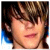 six dark green with white and orange text reading "BASS PLAYERS ROCK!" alongside a pixelated portrait of a person with brown hair