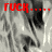 A grayscale image of a person with long hair and a blurred background, overlaid with red Cyrillic text 'ГУСК' followed by four dots in multiple positions.