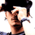 A 50x50 pixel animated buddy icon featuring a mirrored, stylized image of Orlando Bloom's face in two side-by-side frames with black hair and visible ear piercings against a white background.