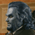 Pixelated grayscale profile of a person with dark hair and a light-colored garment against a brown background.