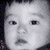 Four- shows a child's face in grayscale top-left, a smiling person with light brown hair top-right, and two orange-toned torso views bottom-left and bottom-right with 'Kaoru' text