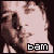 Pixelated static image of a person's face with the text "bam" in blocky white letters on a black background at the bottom right, rendered in low-resolution 256x256 pixels.