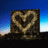 Pixelated static image of two figures in a heart-shaped pose against blue gradient background with dark foreground elements.