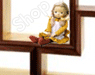 A doll in a yellow dress sits inside a brown wooden frame with white background, positioned on the left side of the frame.
