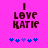 Pixelated text "I LOVE KATIE" in dark brown on bright pink background with blue and purple puzzle pieces below.