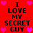 Red background with black text reading "I LOVE MY SECRET GUY" and pink heart symbols in a pattern