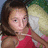 A pixelated image of a person in red clothing holding a pillow, with yellow text on a bright pink background reading 'love to dance'.