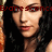 Pixelated close-up of a person with dark hair and light skin, wearing red lipstick, overlaid with red pixelated text across the eyes.