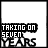 A black-and-white animated sequence showing a static text block 'TAKING ON SEVEN YEARS' with evolving pixelated decorative elements above and below the text.
