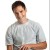 Pixelated image of a person wearing light gray short-sleeve shirt with dark accents, standing against plain white background.