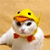 A pixelated white animal with large dark eyes wears a yellow helmet with black dots and an orange beak-like nose, standing against a light brown background.