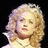 Pixelated image of a person with curly blonde hair against black background, next to bright pink with blue text asking 'Am I really THAT beautiful?!'
