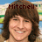 A pixelated image of a person with brown hair smiling, with text above the head in different frames.