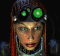 Animated avatar with green goggles, red braided hair, and blue accents on a black background.
