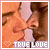 nine identical pixelated images showing a couple kissing, each with 'TRUE LOVE' text and heart symbols at the bottom