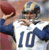 Static AIM buddy icon featuring two pixelated figures in sports attire with a large number 10 on the front of one figure's shirt, set against a blurred background.